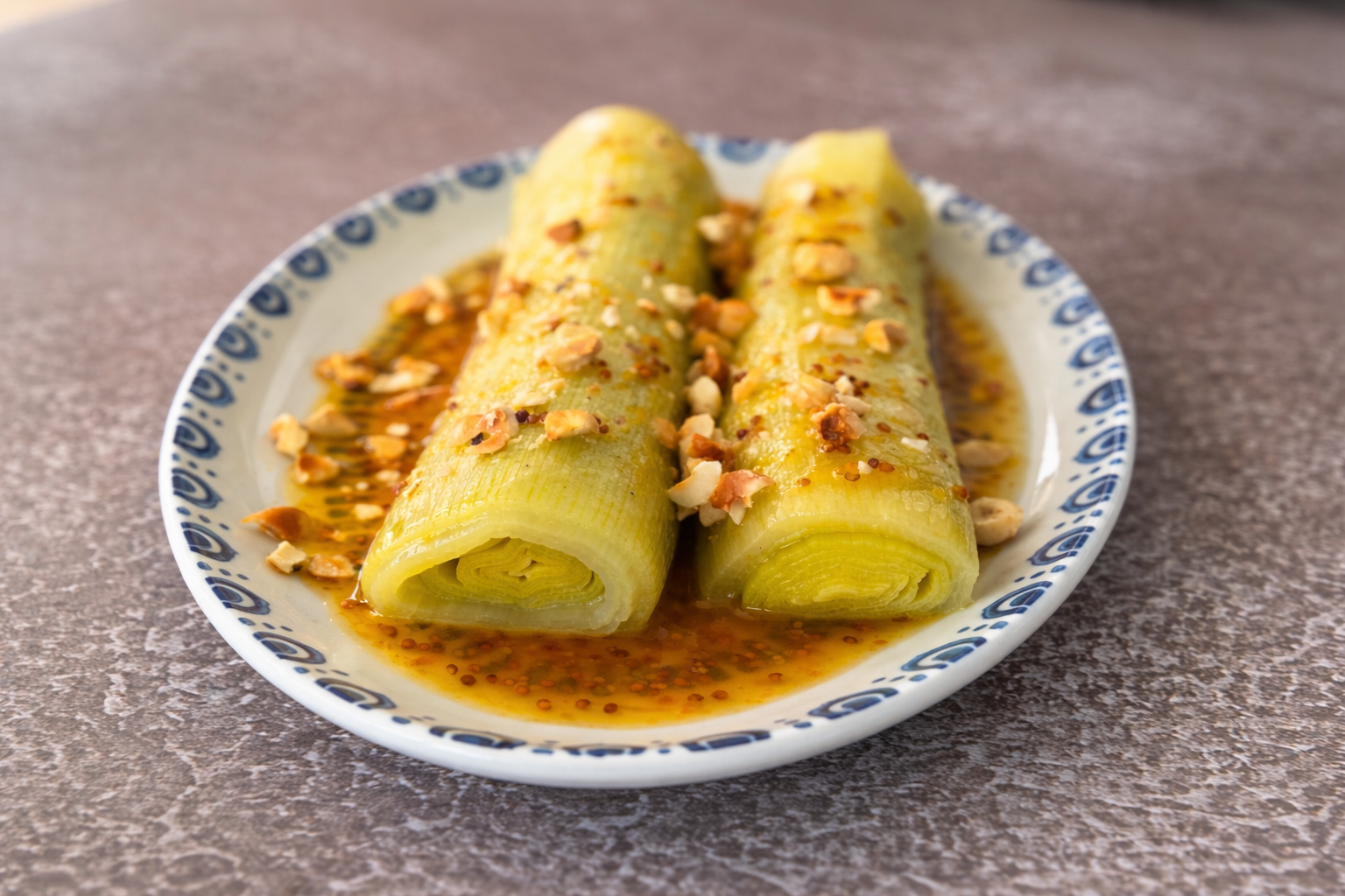 puerros glaseados con vinagreta de naranja y miel
